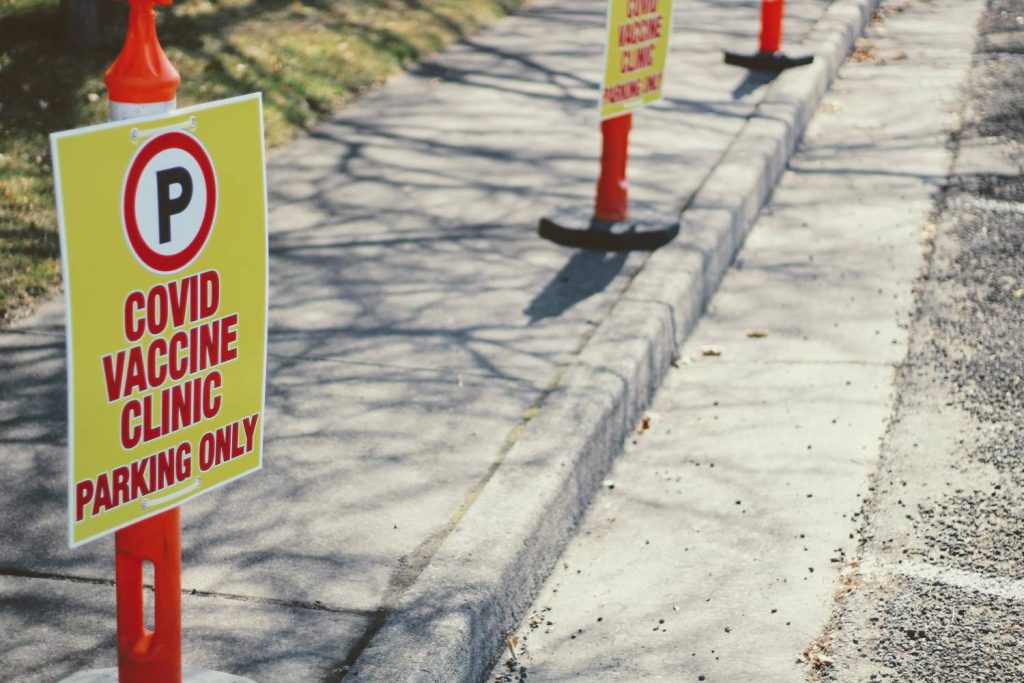 covid vaccine parking sign