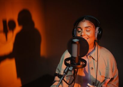 person singing into and wearing Beyerdynamic PRO X products