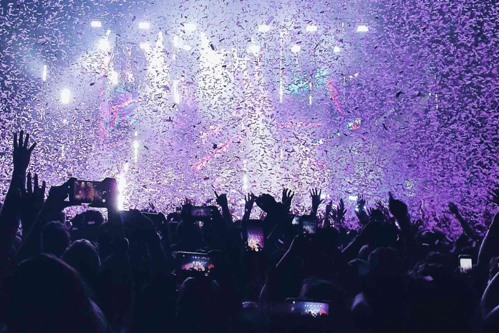 crowd at live music gig with phones out