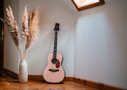 PRS Lotus Pink SE P20E guitar in home